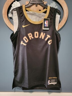 Nike Toronto Raptors Black and Gold Swingman Jersey. New. Authentic With Tags.